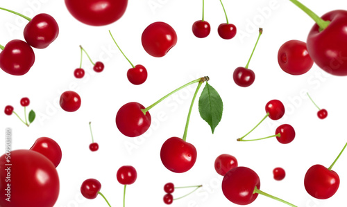 Flying cherry isolated on a white background. Falling red cherry berries. Berry fly pattern.