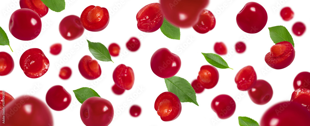 Flying cherry with green leaves isolated on a white background. Falling red berries pattern. Banner. Flying cherry with green leaves isolated on a white background. Falling red berries pattern. Banner.