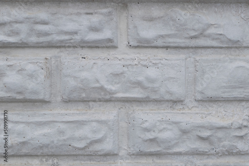 Wall of white bricks close-up