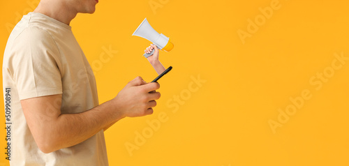 Young man with mobile phone...