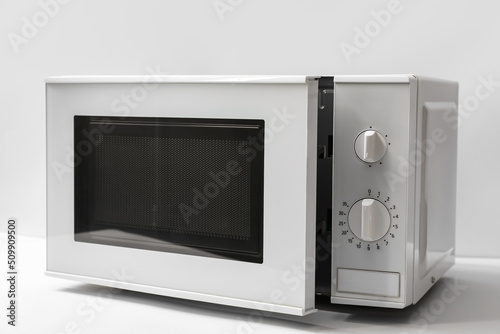 New modern microwave oven on light background