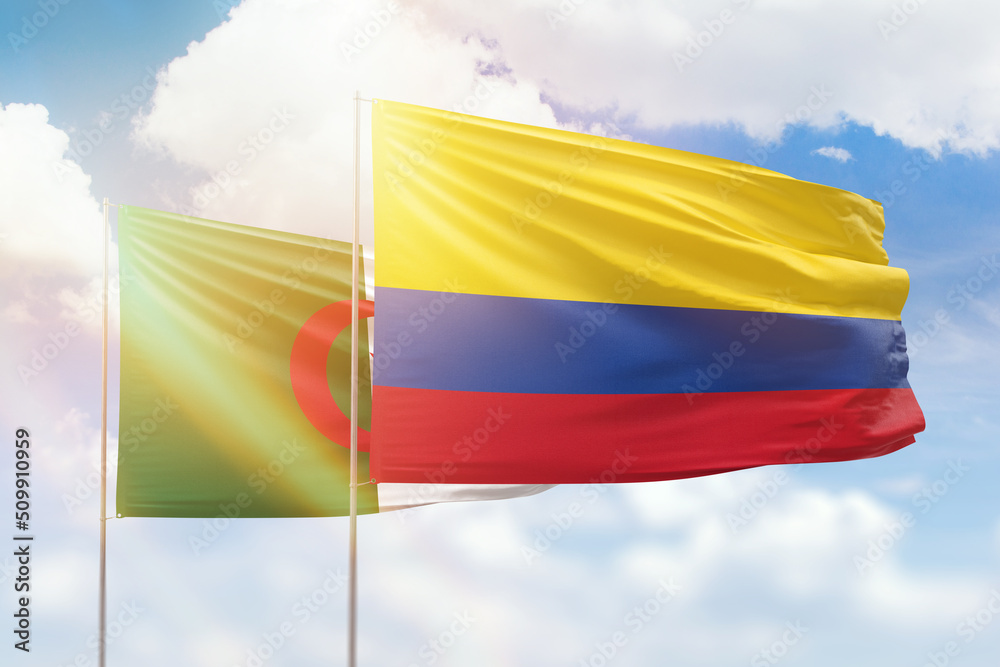 Sunny blue sky and flags of colombia and algeria Sunny blue sky and flags of colombia and algeria