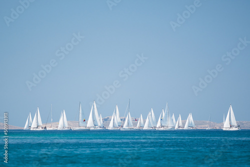 Water sports, Sailing yacht group regatta race on sea near Vodice in Croatia, Adriatic sea photo