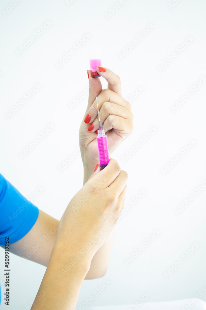 Professional laboratory technician preparing injection on white background Professional laboratory technician preparing injection on white background
