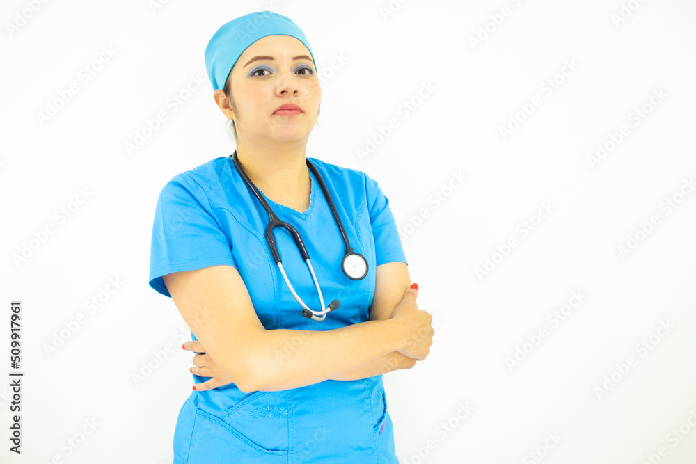 Beautiful female doctor wearing uniform and blue surgical cap, professional woman with stethoscope on her neck on white background Beautiful female doctor wearing uniform and blue surgical cap, professional woman with stethoscope on her neck on white background