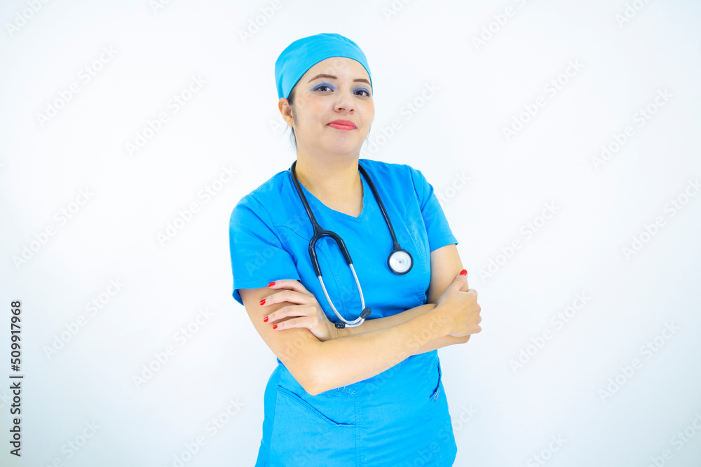 Beautiful female doctor wearing uniform and blue surgical cap, professional woman with stethoscope on her neck on white background Beautiful female doctor wearing uniform and blue surgical cap, professional woman with stethoscope on her neck on white background