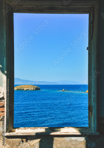 Window to the sea in an abandoned house and across the islands  the Aegean sea  Fo  a  Phokaia