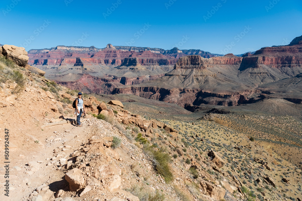 Woman hiking the South Kaibab Trail of the Grand Canyon in Arizona.
