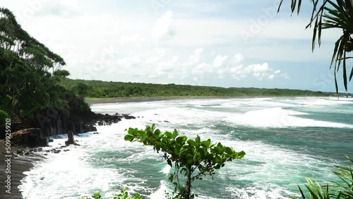 View of the ocean waves on the Karang Tawulan beach, Indonesia photo