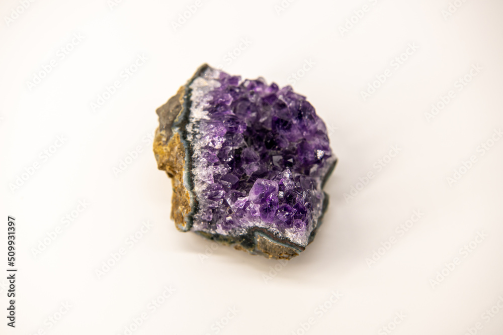 Amethyst geode isolated on the white background, purple gemstone, close up image with copy space for text
