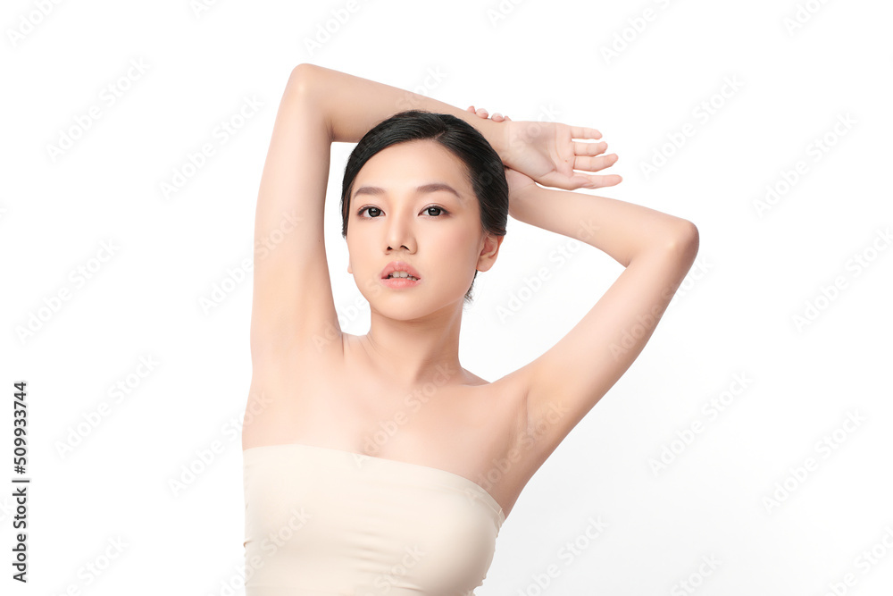Beautiful Young Asian woman lifting hands up to show off clean and hygienic armpits or underarms on white background, Smooth armpit cleanliness and protection concept Beautiful Young Asian woman lifting hands up to show off clean and hygienic armpits or underarms on white background, Smooth armpit cleanliness and protection concept