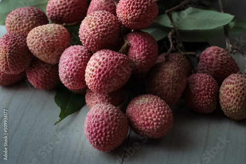 Close up of bunch of pink litchi or lychee fruit. selective focus