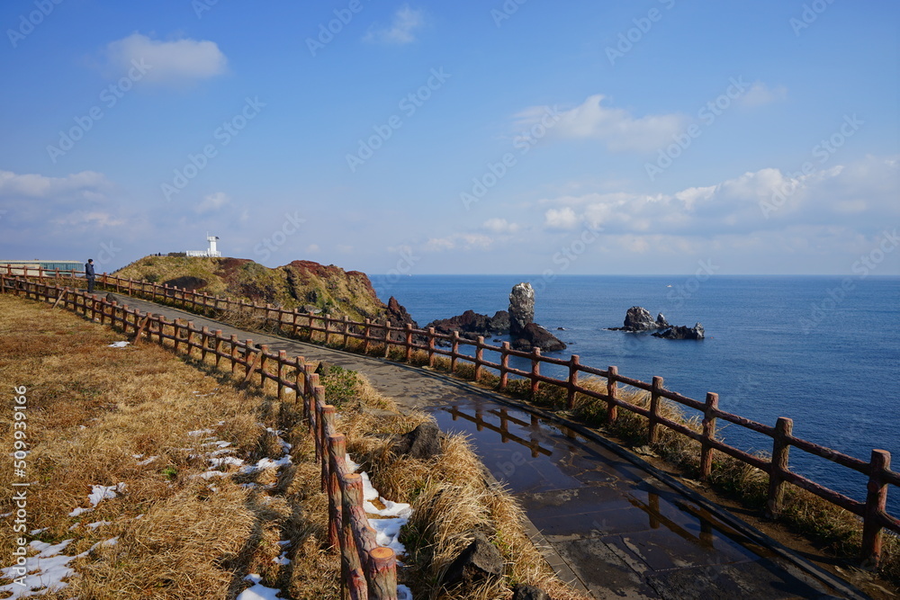 lighthouse and seaside walkway lighthouse and seaside walkway