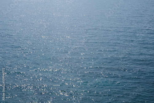 Fototapeta Naklejka Na Ścianę i Meble -  blue clear summer landscape background, sparkling sea water on sun, natural texture