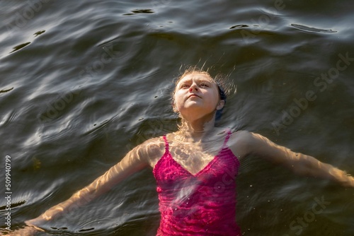 Girl floating in the sea
