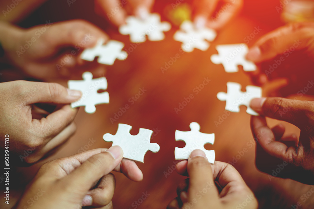 teamwork white business and puzzle of cooperation unity concept jigsaw puzzle close-up hand of hand connected jigsaw puzzle connected to each other business solution Success Concepts and Strategies
