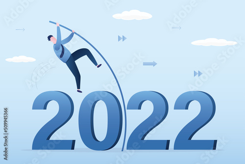 Confident businessman doing pole vaulting crossover crisis valley. Entrepreneur jumping over 2022 year with pole. Way forward, Successful overcoming obstacles, concept. Achieving success.