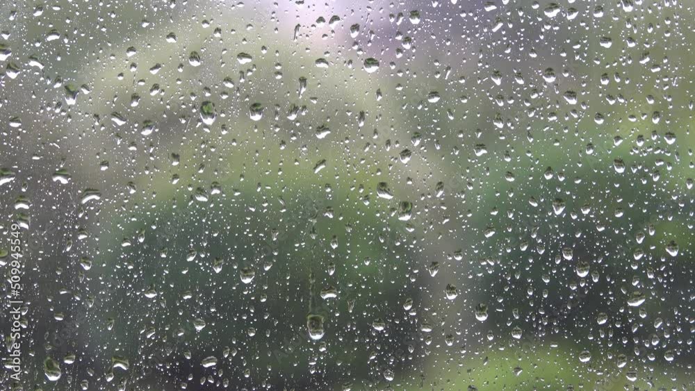 Background of glass covered with falling drops of heavy rain. Background of glass covered with falling drops of heavy rain.