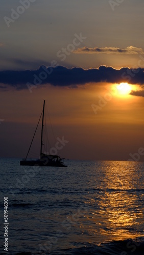 Yacht in the sea at sunset, sailing boat at sunset. © Veruree
