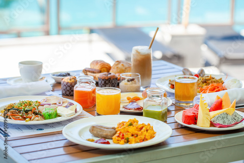 Fotografie Close up of buffet healthy breakfast beautifully served and decorated on wooden table in cafe