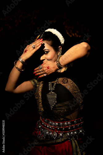 Indian woman Odissi dancer doing classical dance form. Orissi dance. art and culture of india. photo