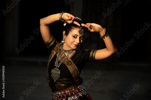 Indian woman Odissi dancer doing classical dance form. Orissi dance. art and culture of india.