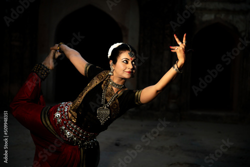 Indian woman Odissi dancer doing classical dance form. Orissi dance. art and culture of india.