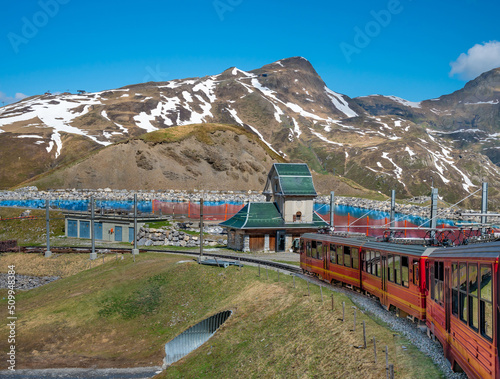  Red train to Jungfraujoch over Swiss Alps.