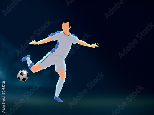 Faceless Footballer Player Kicking Ball On Blue Background And Copy Space. © Abdul Qaiyoom