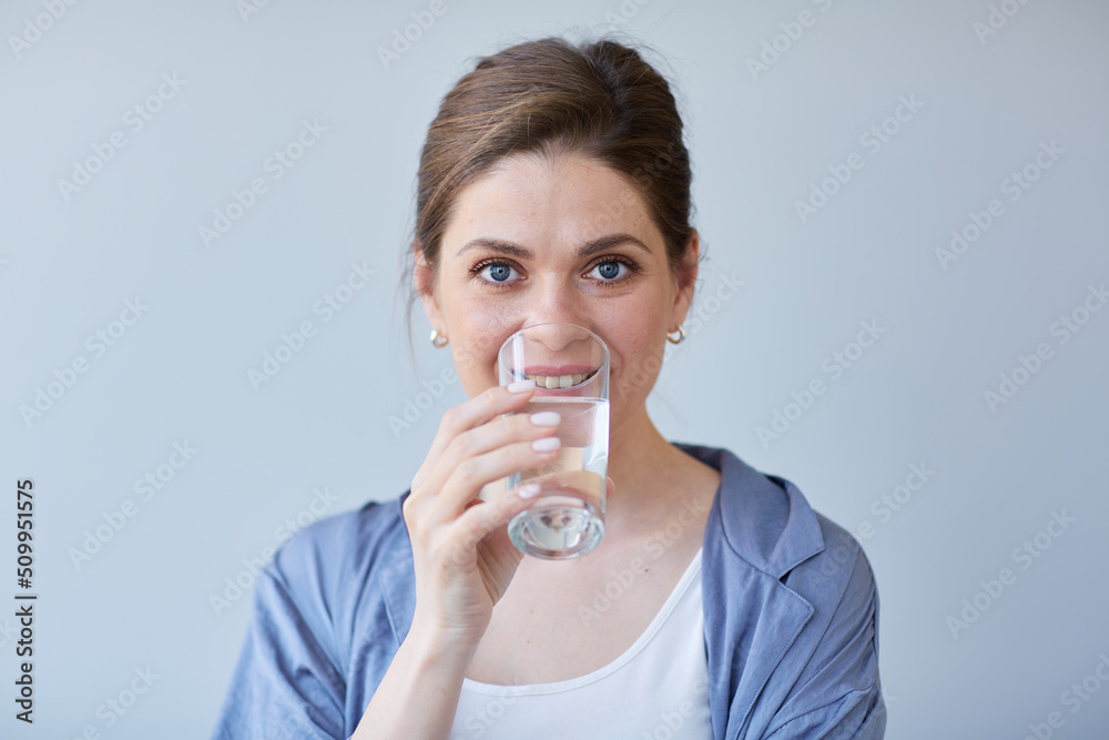 Woman drink water. Girl in casual clothes isolated portrait. Woman drink water. Girl in casual clothes isolated portrait.
