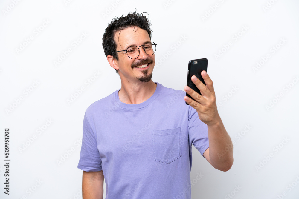 Young man with moustache isolated on white background making a selfie Young man with moustache isolated on white background making a selfie