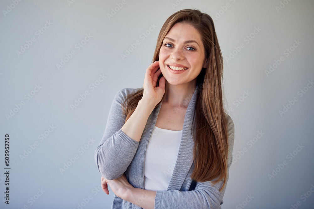 Beautiful woman with natural skin and long hair touch her chin. Isolated portrait of girl wearing casual clothes. Beautiful woman with natural skin and long hair touch her chin. Isolated portrait of girl wearing casual clothes.