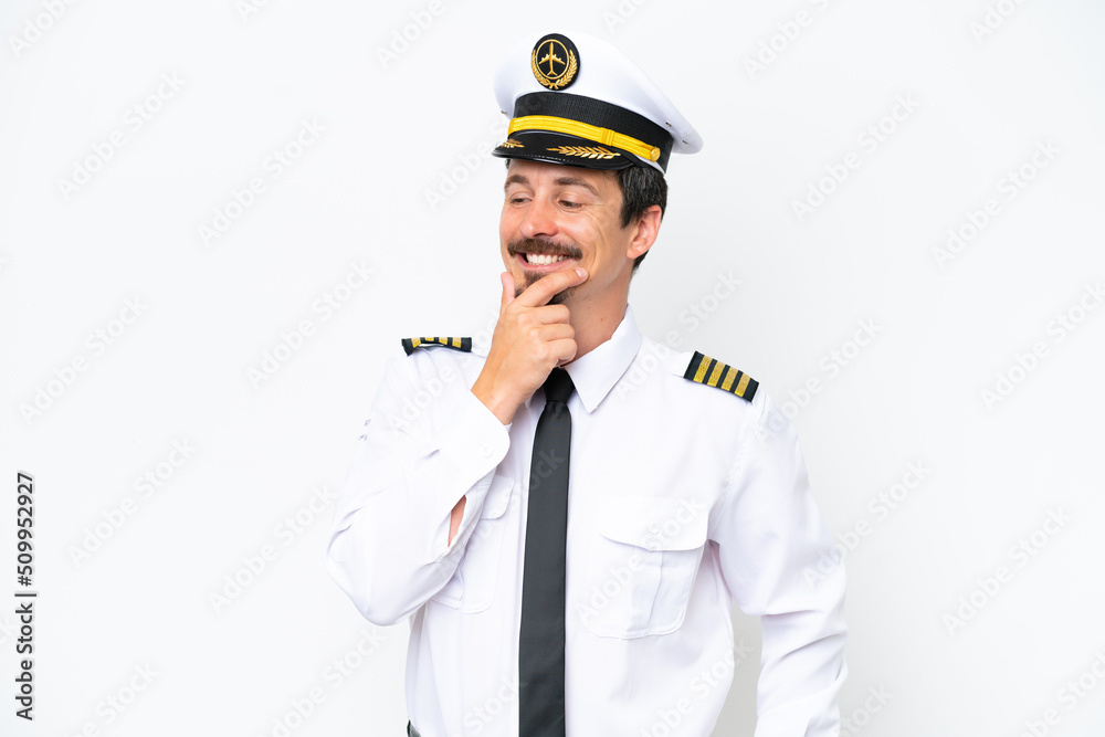Airplane caucasian pilot isolated on white background looking to the side