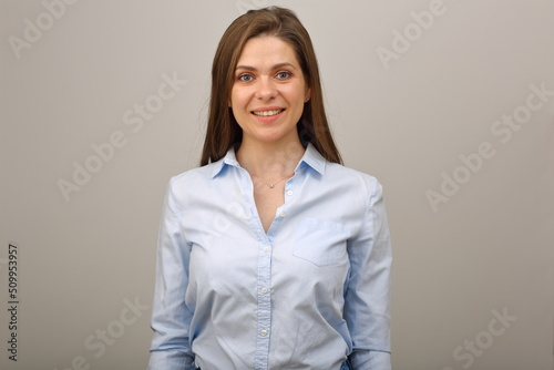 Smiling caucasian woman in blue shirt. isolated business portrait.