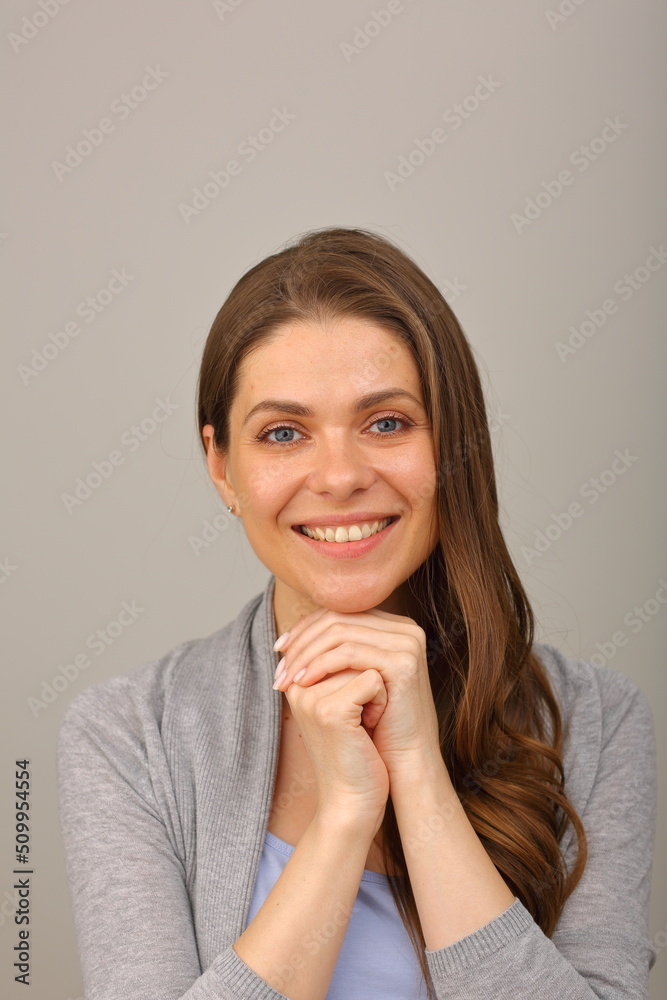 Close up woman face portrait. Isolated head shot of smiling woman leaned on hands. Close up woman face portrait. Isolated head shot of smiling woman leaned on hands.