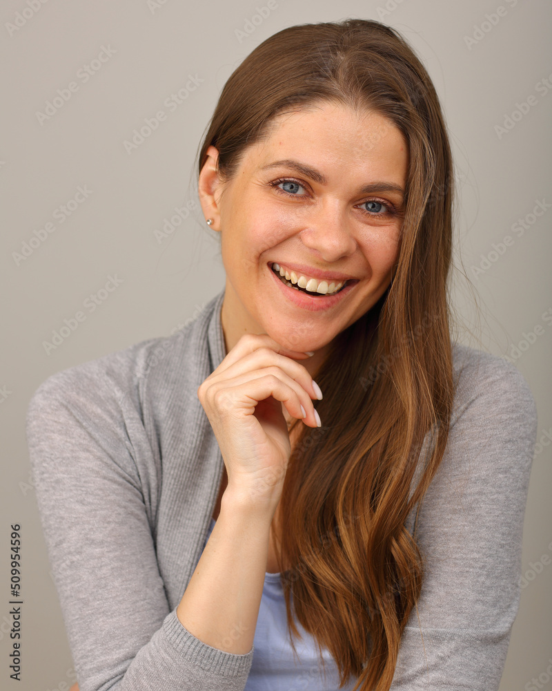 Smiling happy woman with long wavy hair. Isolated face close up. Smiling happy woman with long wavy hair. Isolated face close up.