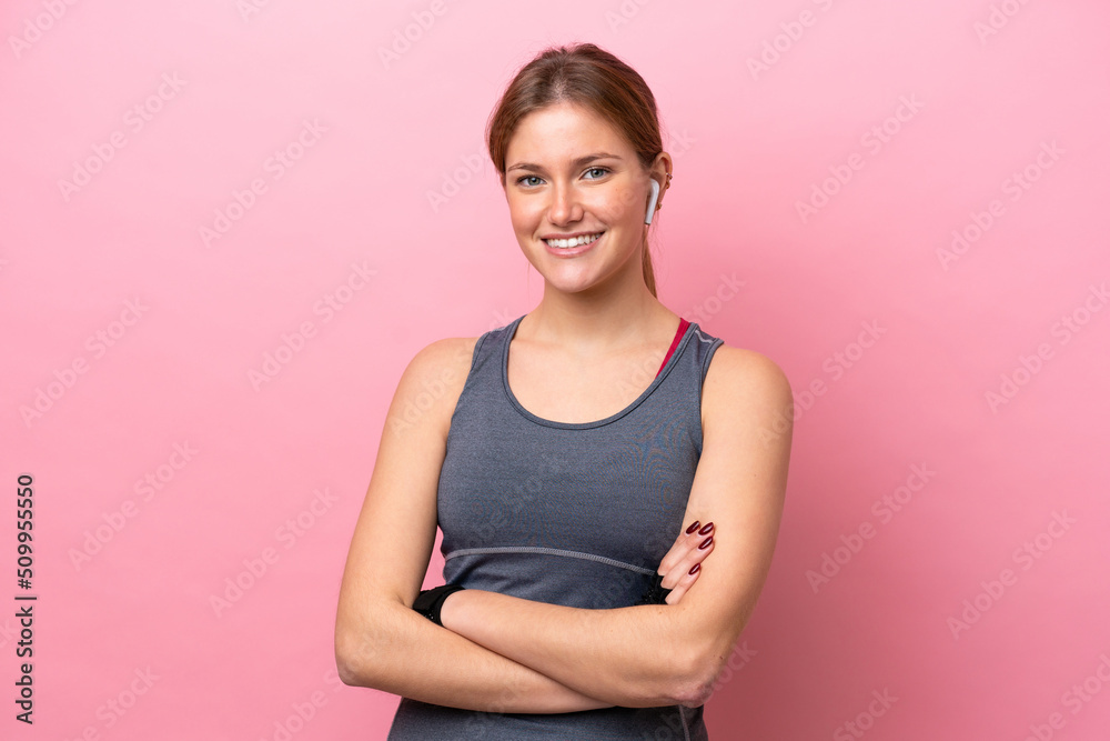 Young sport caucasian woman isolated on pink background keeping the arms crossed in frontal position Young sport caucasian woman isolated on pink background keeping the arms crossed in frontal position