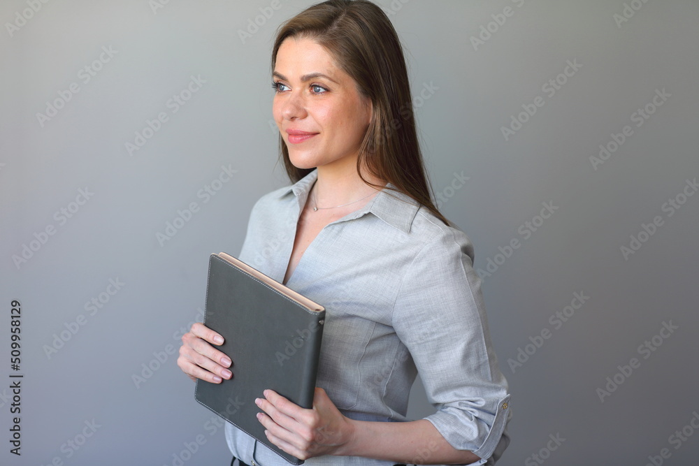 Teacher with book looks away. Isolated portrait. Teacher with book looks away. Isolated portrait.