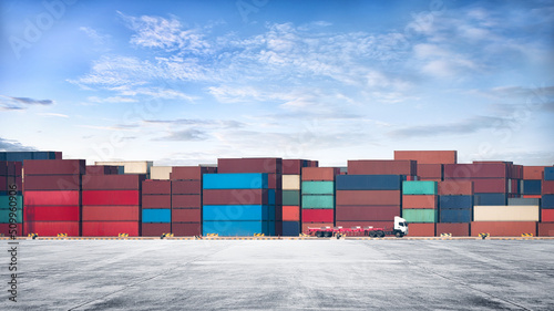 Containers Yard on blue sky background and floor ground with container truck, Global Business Logistics import export goods of freight carrier, industrial port, cargo transportation industry concept