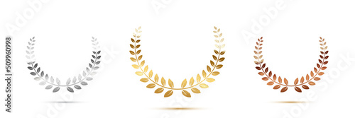 Golden, silver and bronze award signs with laurel wreath isolated on white background. Vector award design templates
