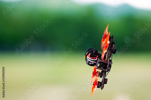 Freestyle FPV quadcopter drone in the air.