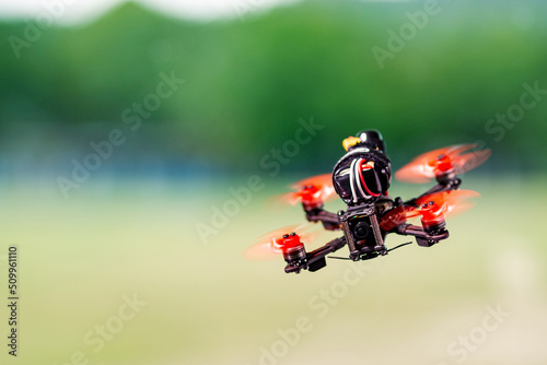 Freestyle FPV quadcopter drone in the air.