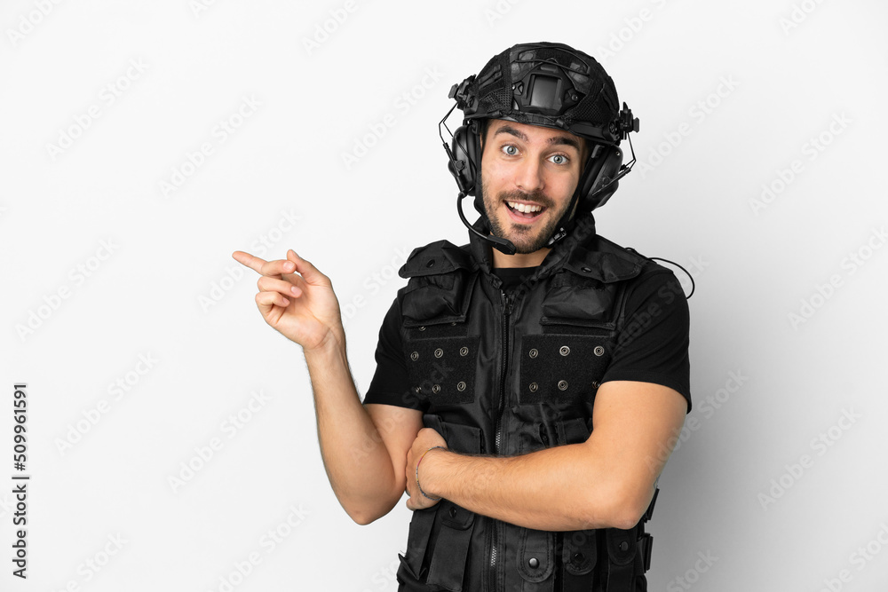Young caucasian swat isolated on white background pointing finger to the side Young caucasian swat isolated on white background pointing finger to the side