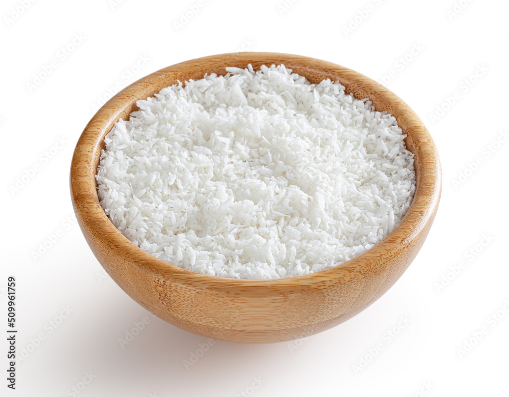 Coconut flakes in wooden bowl isolated on white background with clipping path Coconut flakes in wooden bowl isolated on white background with clipping path