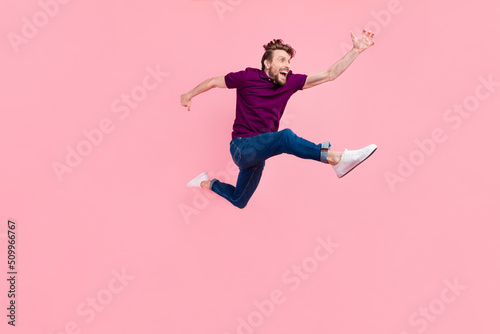 Full body profile side photo of young man go walk run rush discount promo isolated over pink color background