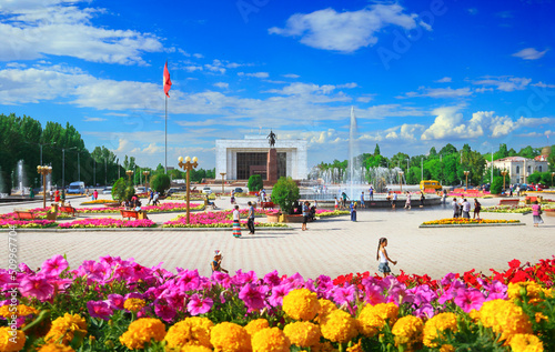 Beautiful view of Ala-Too Square, Kyrgyz Historical Museum, walking local people and blue sky in Bishkek - the capital of Kyrgyzstan, Central Asia photo