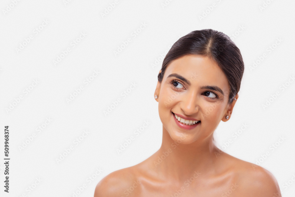 Close-up portrait of a cheerful young woman with clear and spotless skin Close-up portrait of a cheerful young woman with clear and spotless skin