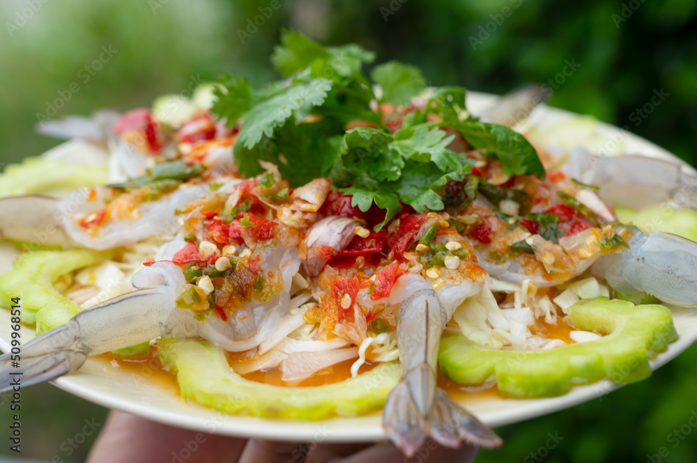 Shrimp in fish sauce with green rest on plate - Asian style
