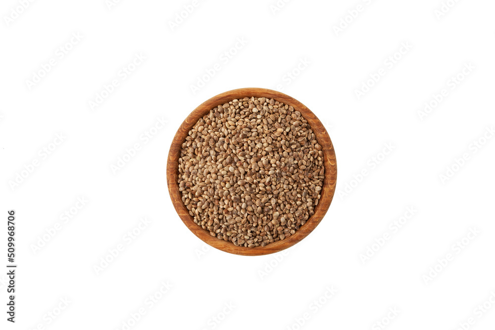 Hemp seeds in wooden bowl on white background, top view. Healthy eating. Cannabis seeds are source of Omega-3 fatty acids, protein, magnesium and other trace elements Hemp seeds in wooden bowl on white background, top view. Healthy eating. Cannabis seeds are source of Omega-3 fatty acids, protein, magnesium and other trace elements