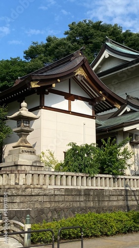 The rooftop decor and stone lantern of ancient Japanese shrine house  Ueno park  Gojyoten Jinjya    temple  year 2022 sunny weekday 